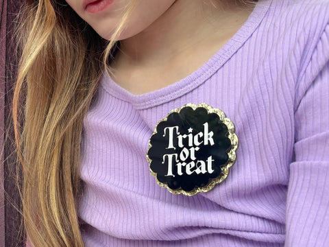 BLACK + GOLD TRICK OR TREAT MAGNETIC BADGE