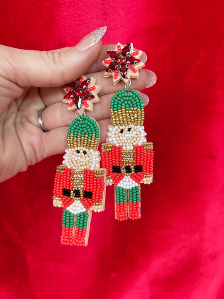 RED NUT CRACKER STATEMENT EARRINGS